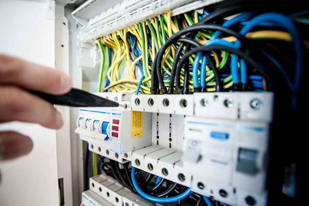 an electrcal engineer checking the electrical circuit